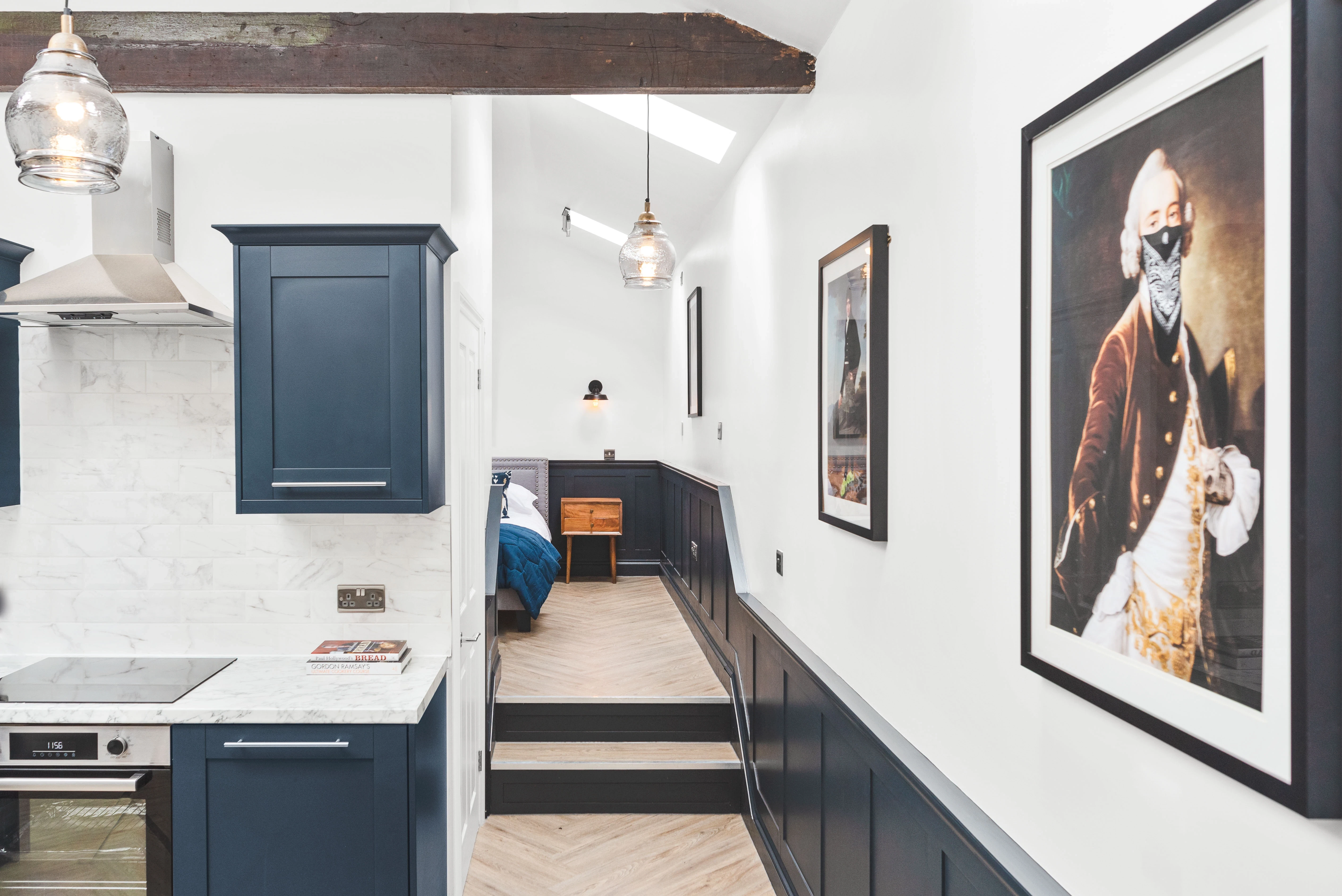 contemporary kitchen hallway with classic artwork