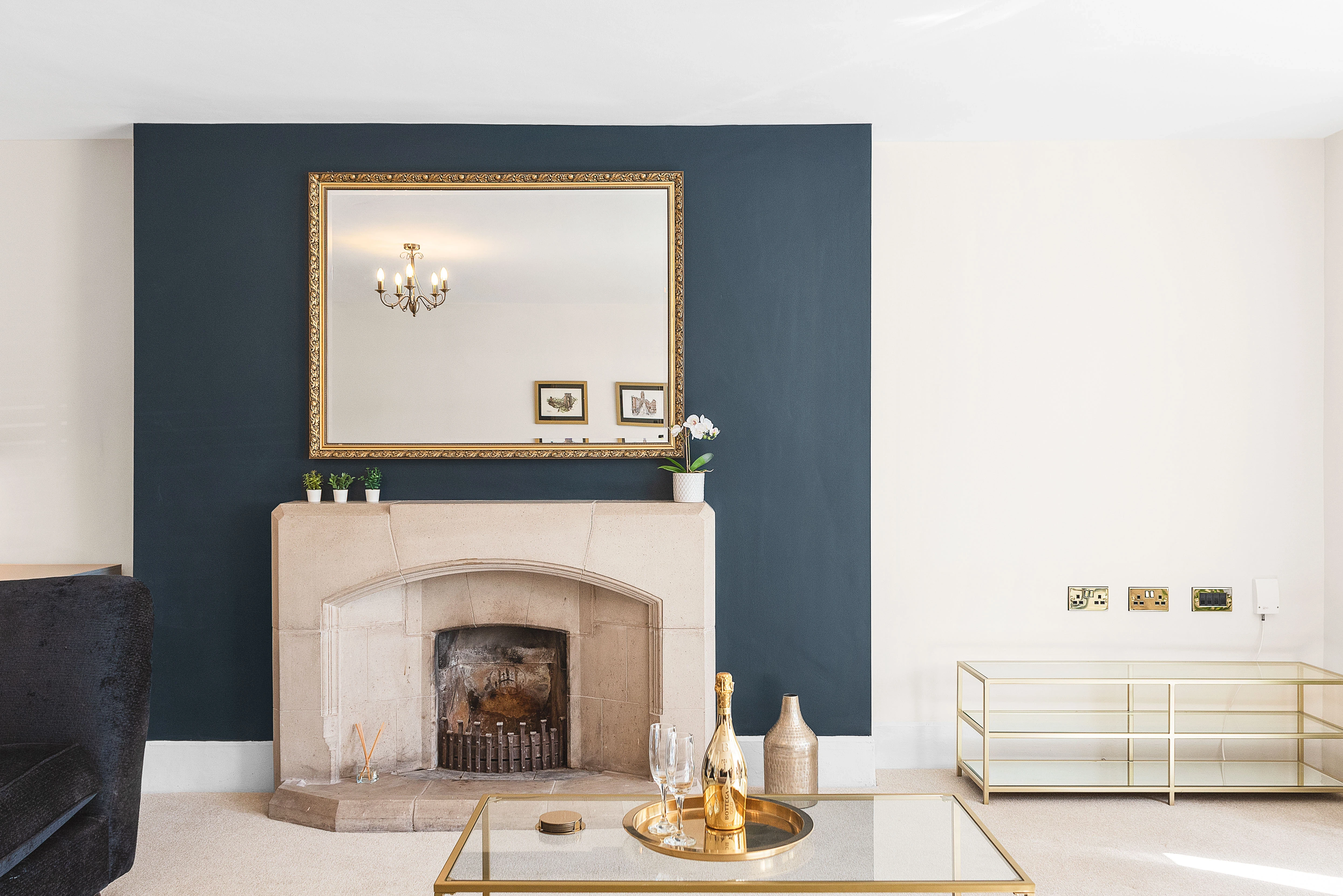 Sneyd Park living room — fireplace beneath a navy accent wall