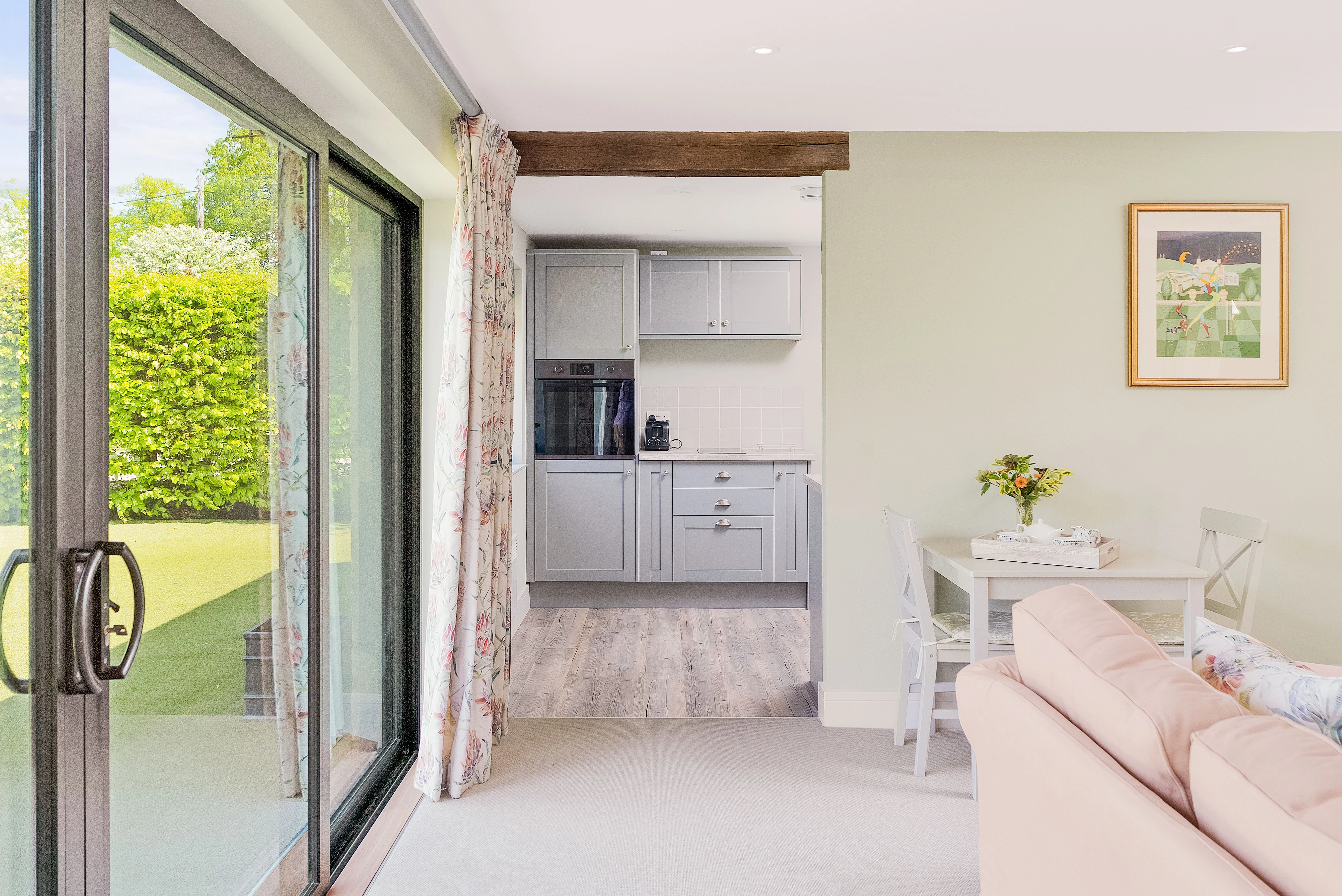 The Old Hay Barn — open-plan living space in soft Cotswold daylight