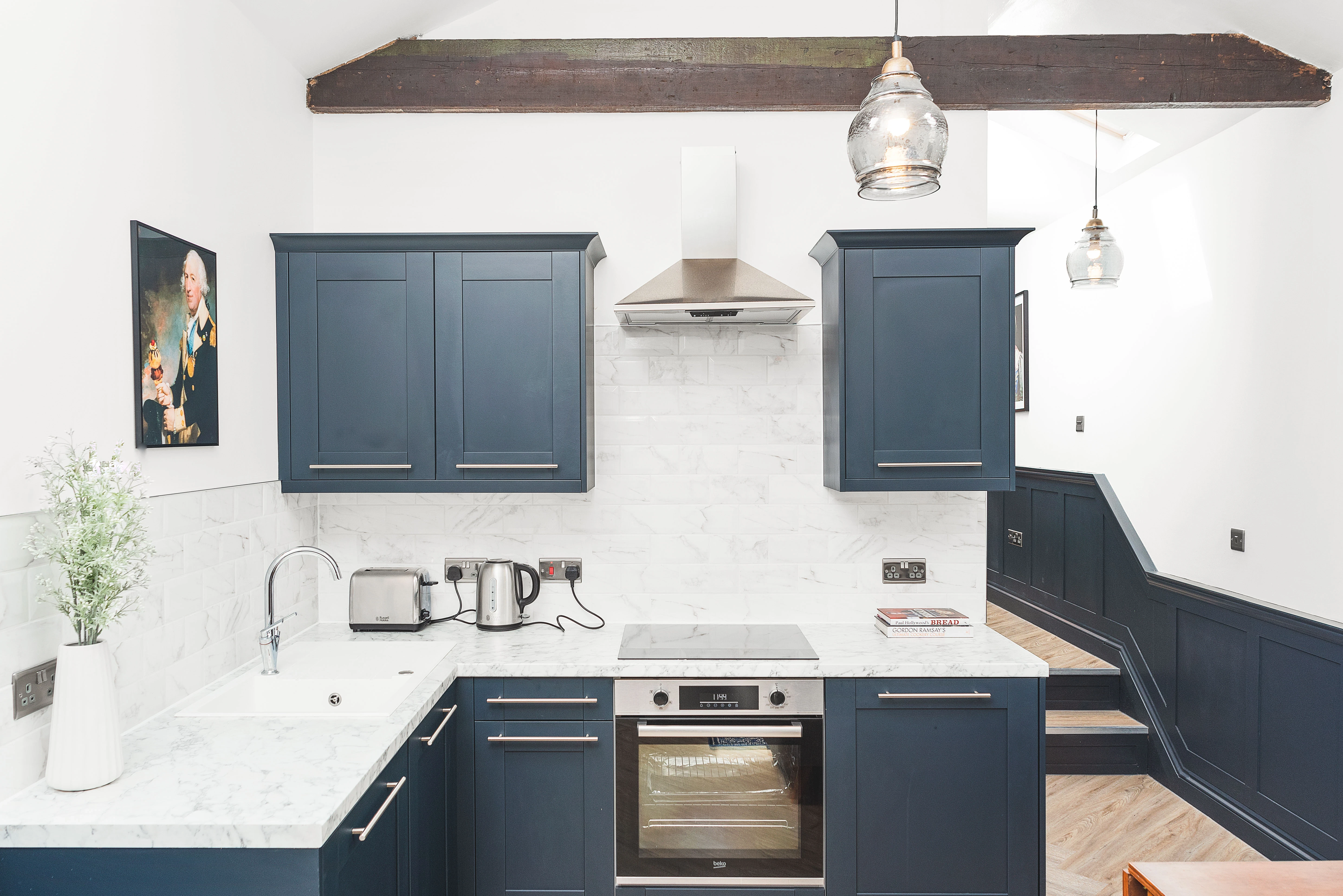 Montpelier Court kitchen — navy cabinetry with marble worktops